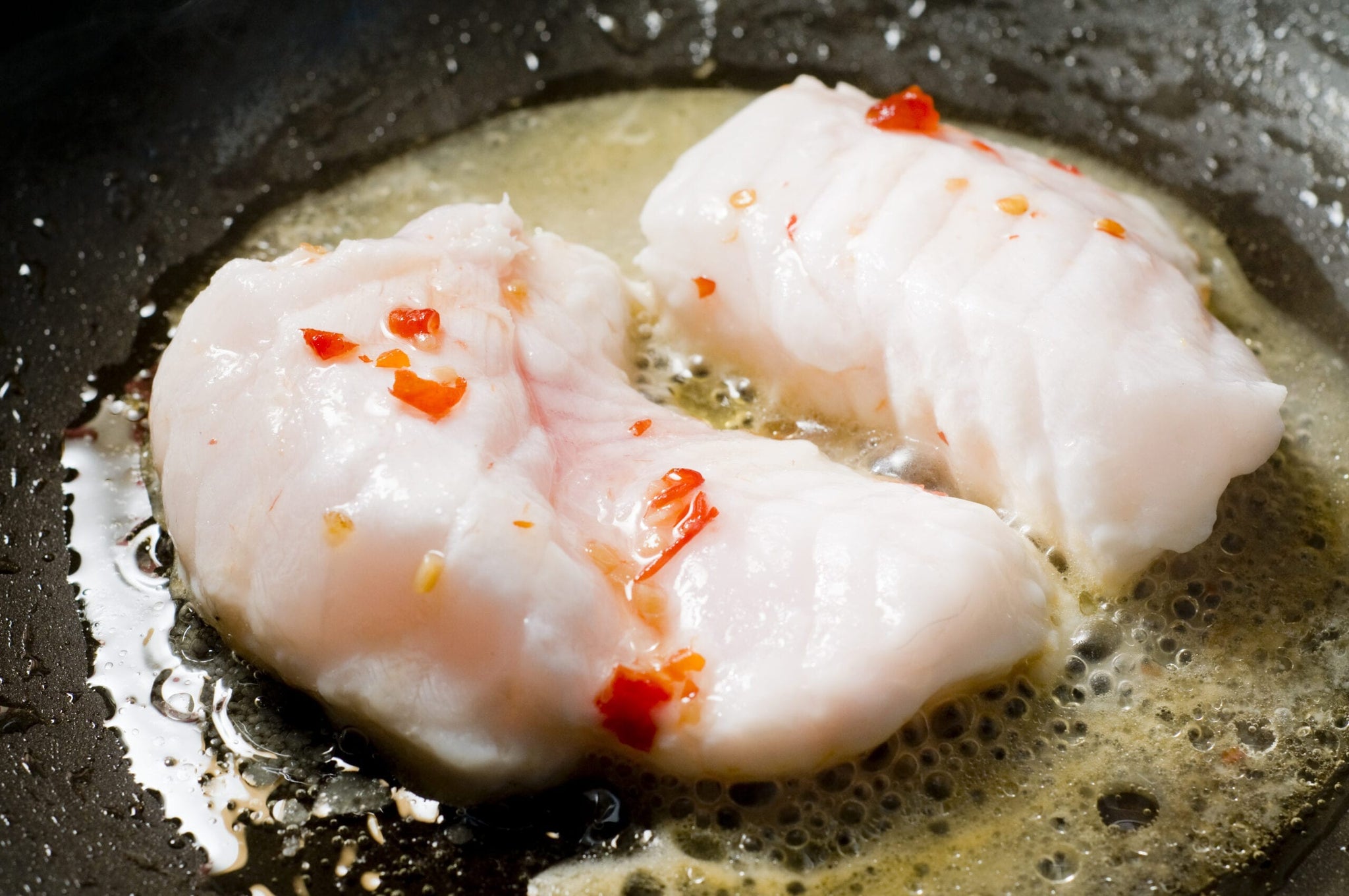 monkfish in pan